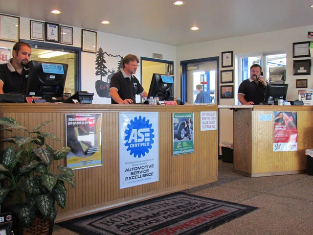 Auto Shop Medford customer service counter with automotive team members.