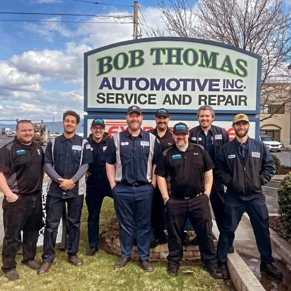 Bob Thomas Automotive owners standing outside their Auto Shop Medford facility.